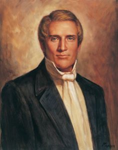 A painting of Hyrum Smith. He wears a black suit coat, white shirt, and white cravat